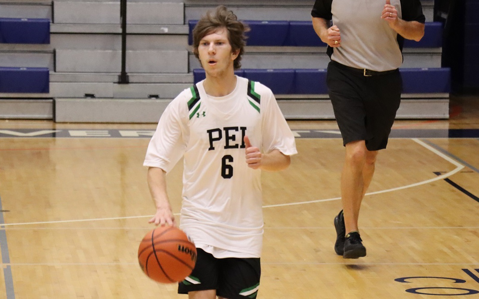 Team PEI 2026 Basketball athlete, Zachary Hebert, dripples the basketball down the court