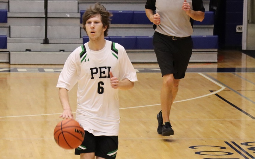 Team PEI 2026 Basketball athlete, Zachary Hebert, dripples the basketball down the court