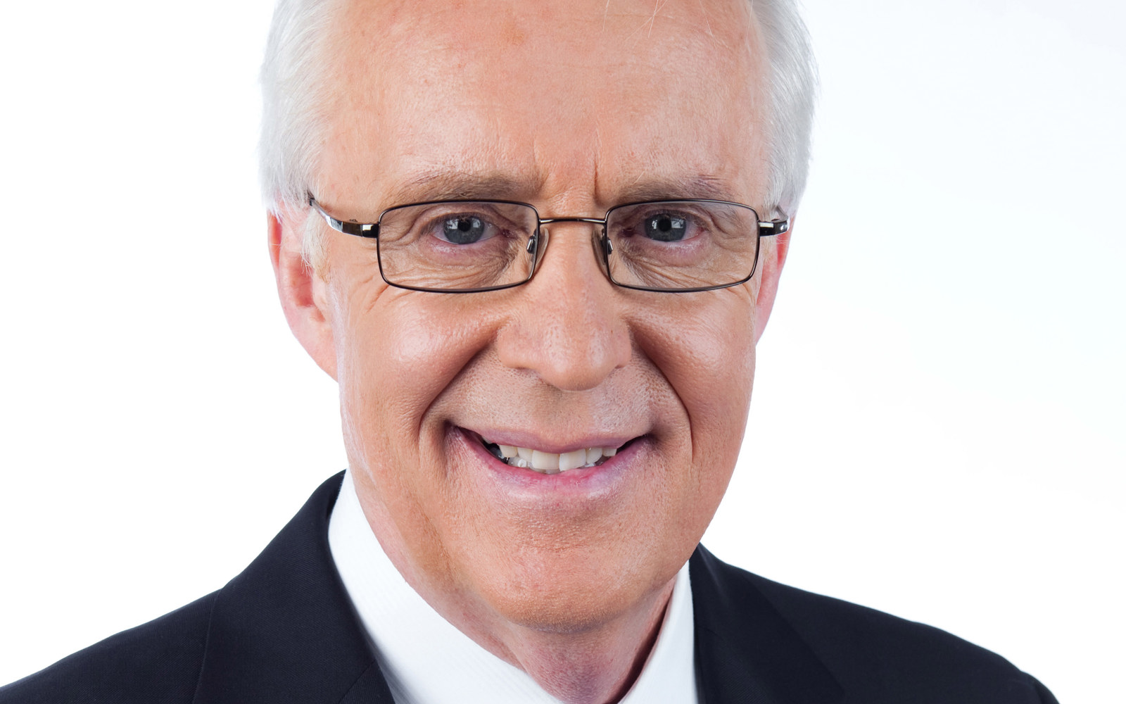 Headshot of a man wearing a suit