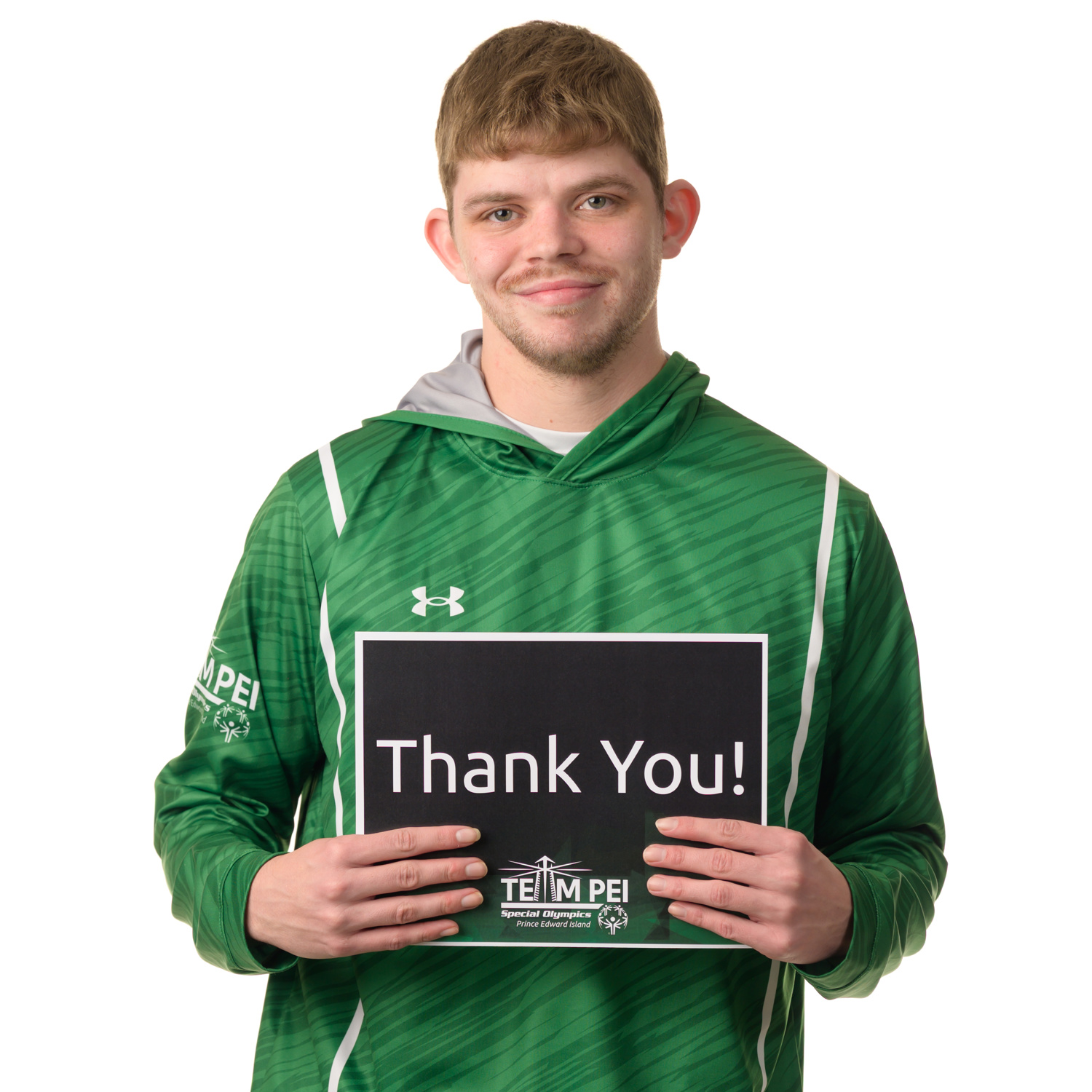 Team PEI 2026 Swimming athlete, Matthew Gallant, standing with a thank you sign
