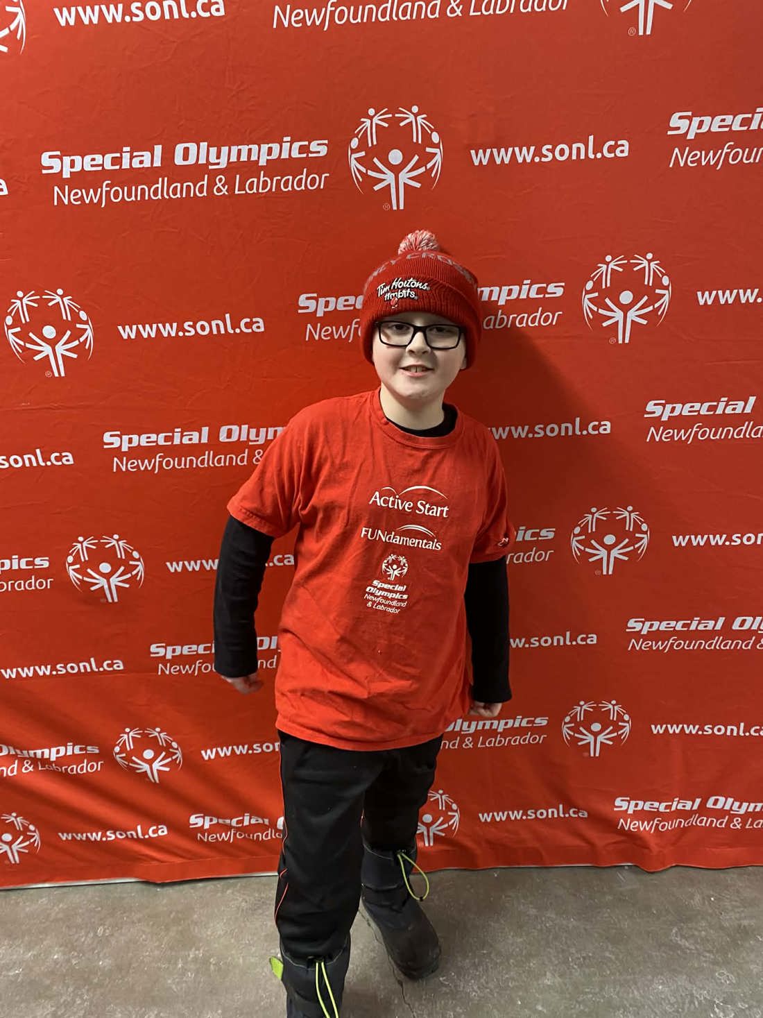 Alexander posing at a Special Olympics event.