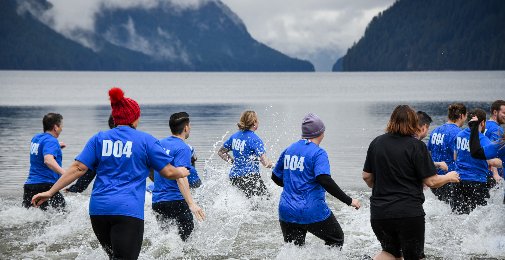 Law Enforcement Torch Run Polar Plunge for Special Olympics BC participants splash into the frigid waters.