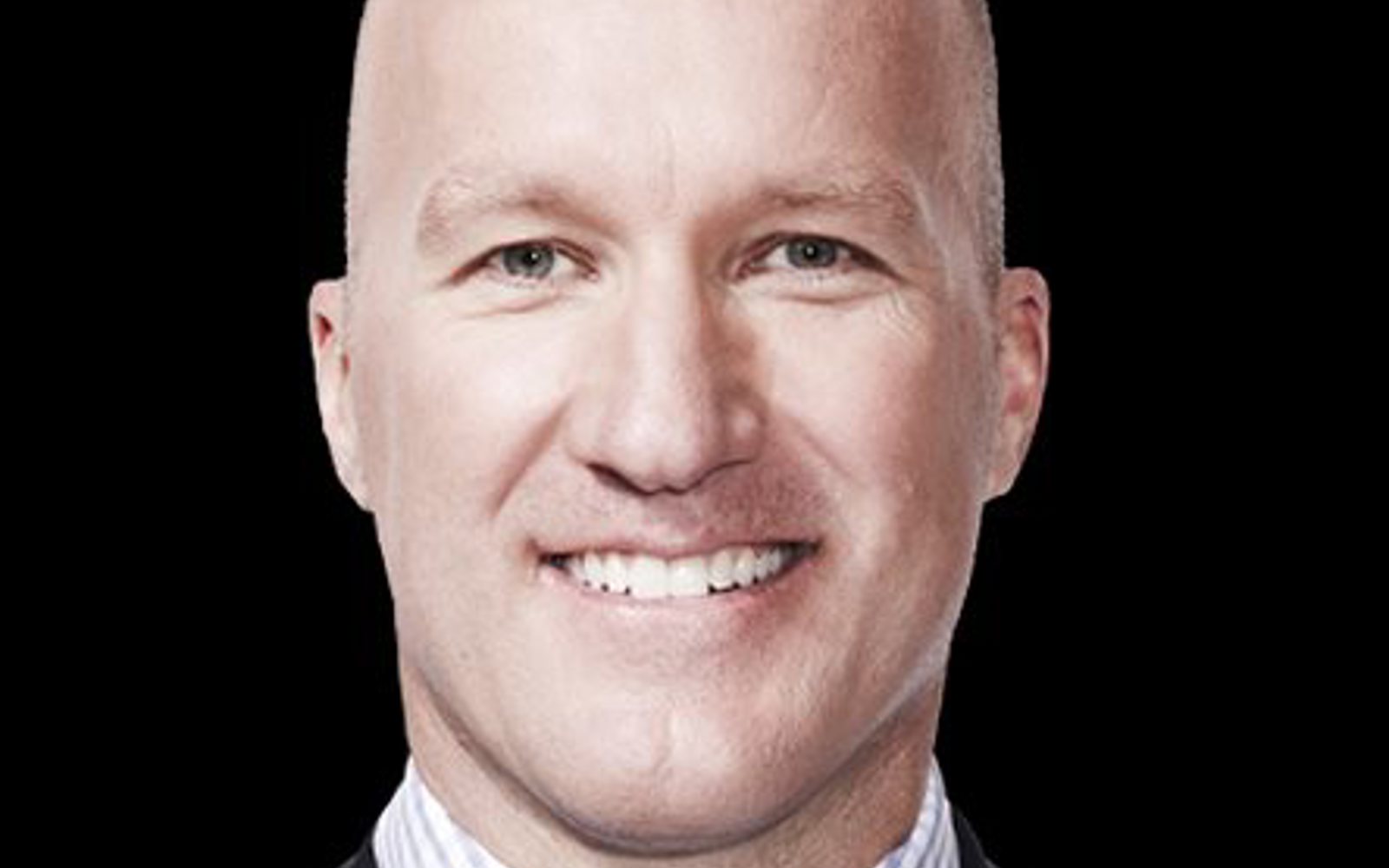 Headshot of a man wearing a suit