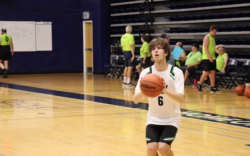 Team PEI 2026 Basketball athlete, Zachary Hebert, holding a basketball, preparing to take a shot on net