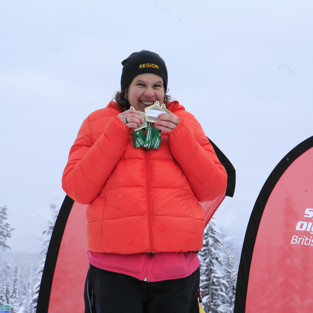 Special Olympics BC - Creston athlete Marlow happily receives their medal at the 2019 SOBC Winter Games.