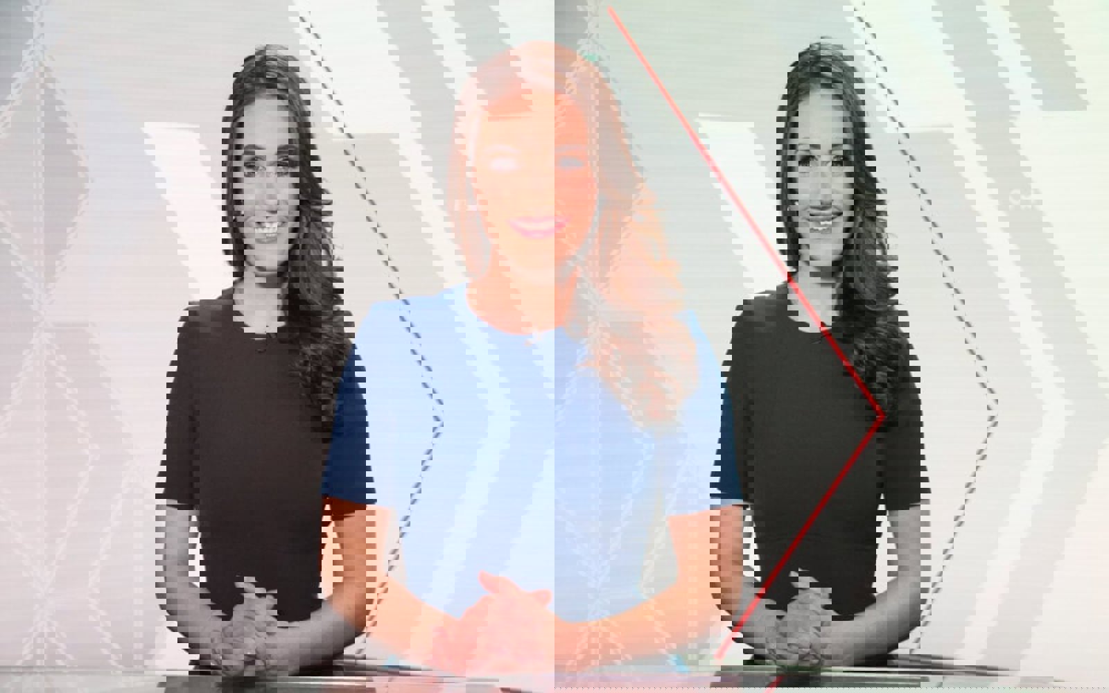 Headshot of a woman with long dark hair in front of a digital screen wearing a blue dress.