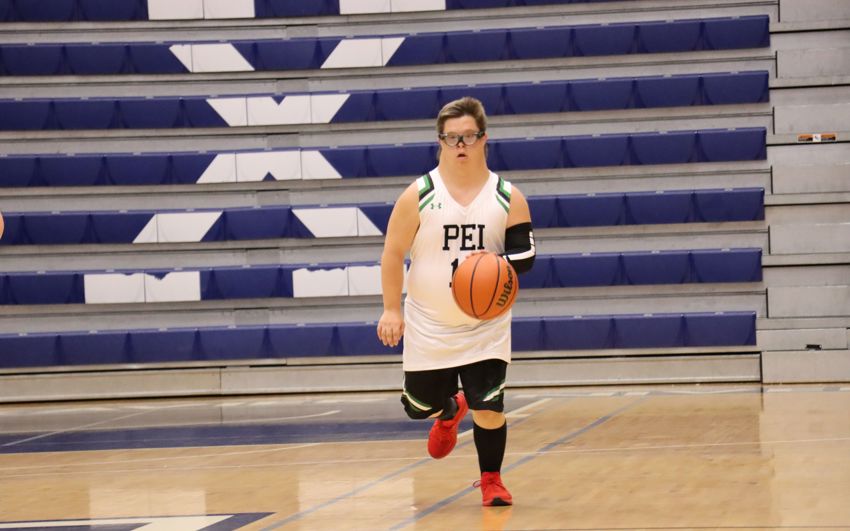 Team PEI 2026 Basketball athlete, Jacob MacNeill, dripples the basketball down the court