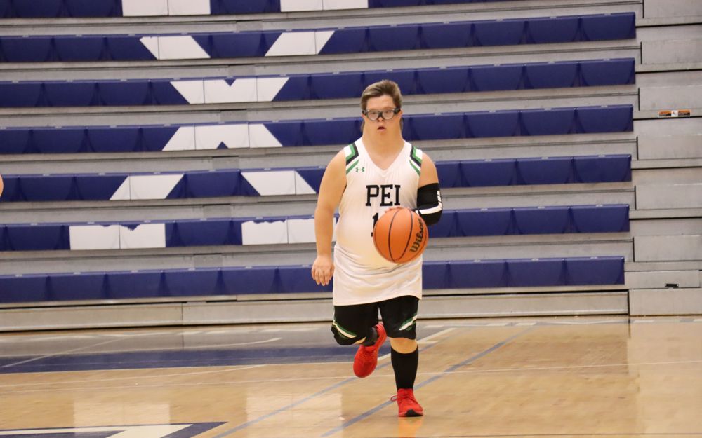 Team PEI 2026 Basketball athlete, Jacob MacNeill, dripples the basketball down the court