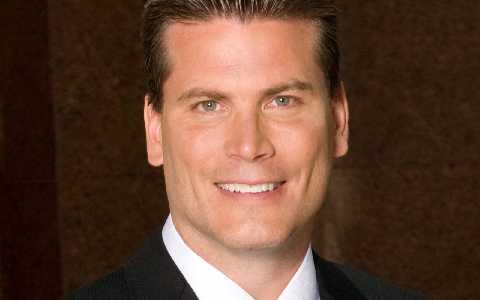 Headshot of a man in a suit