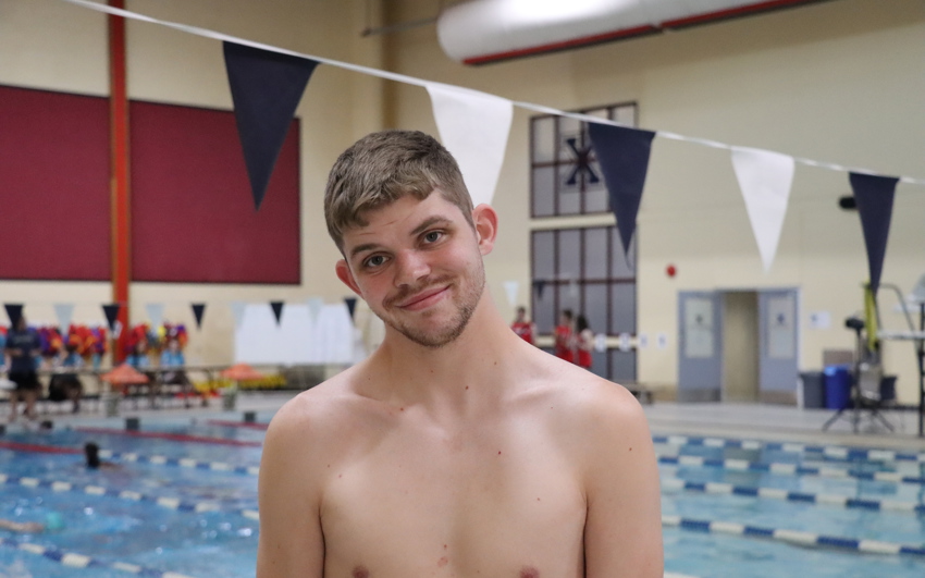 Team PEI 2026 Swimming athlete, Matthew Gallant standing by a pool
