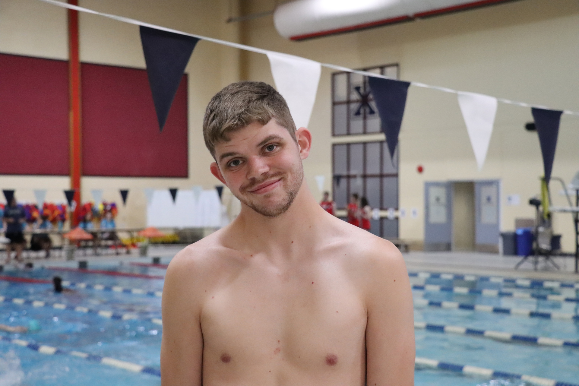 Team PEI 2026 Swimming athlete, Matthew Gallant standing by a pool
