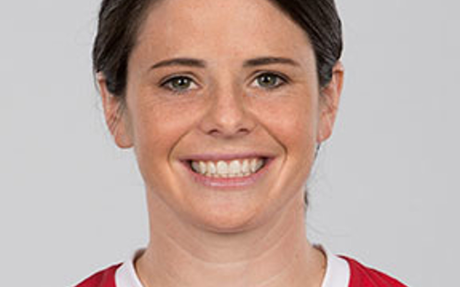 Headshot of a woman in a Team Canada soccer jersey