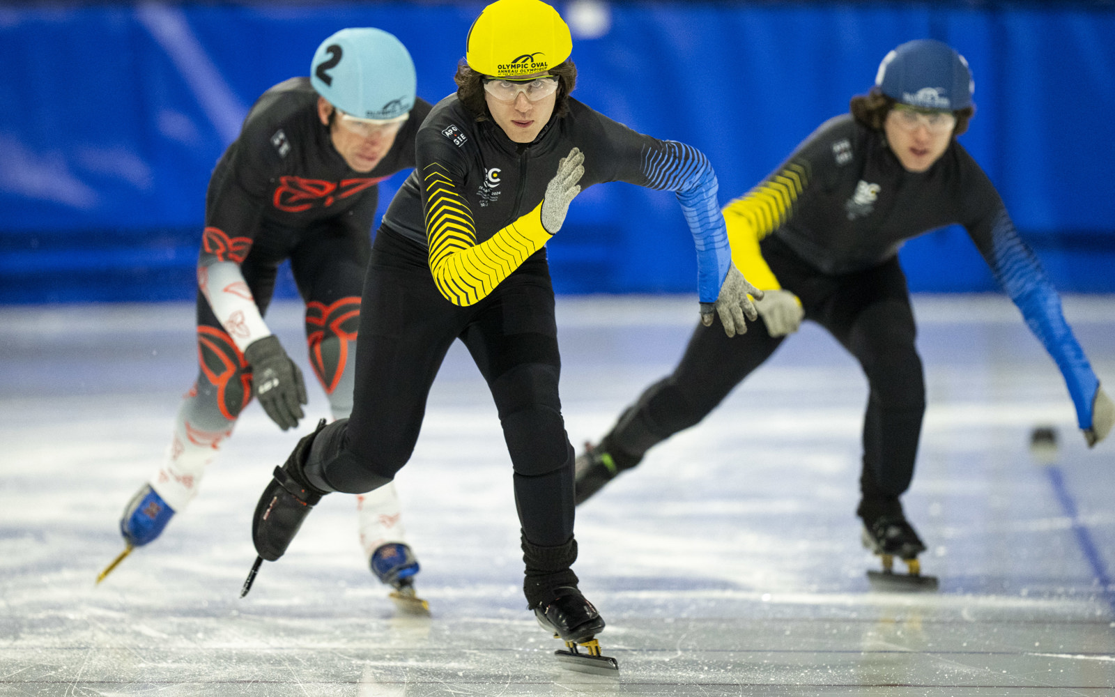 Two Team BC athletes charge down the straight-away at a speedskating race at the 2024 Special Olympics Canada National Winter Games in Calgary.