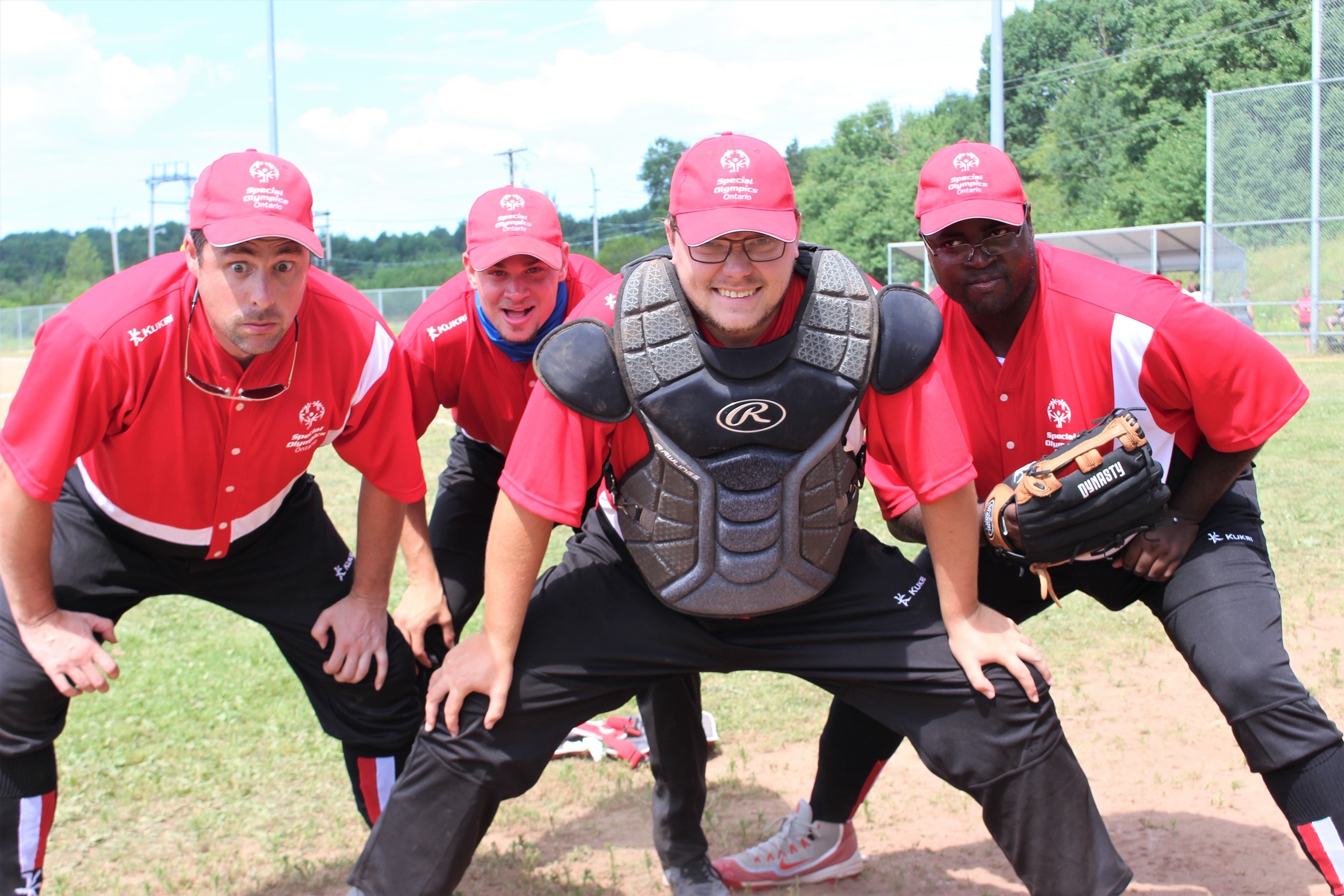 Special Olympics softball players pose for a photo