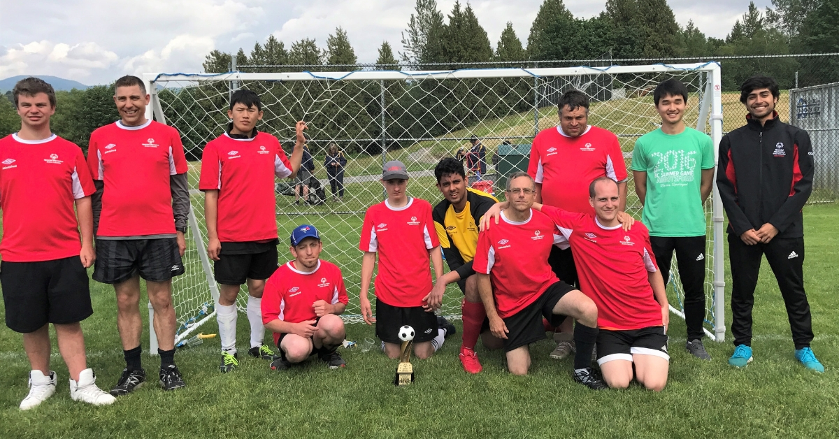 Roshan Gosal with his Special Olympics B.C. soccer team.
