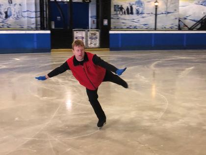 Tim Goodacre performs on the ice.
