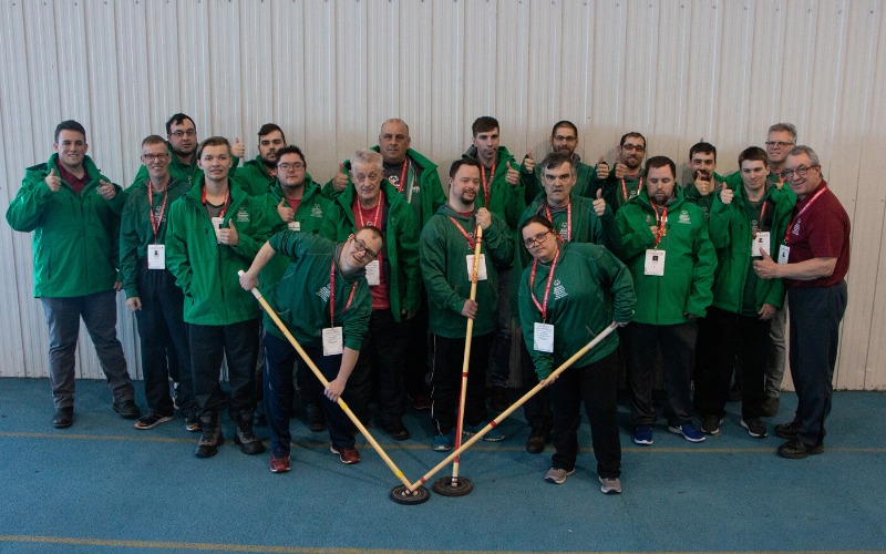 Special Olympics Team New Brunswick floor hockey players pose for a photo