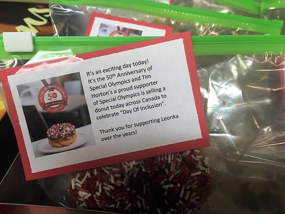 An image of a Donut in a ziplock bag with a note.