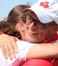 Glenn Cundari hugs one of his SO Team Canada golfers.