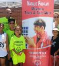 The Pooran family stand for a p hoto at the Natalie Pooran Memorial Track Meet
