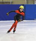 Hillary Birkett speed skating on the ice