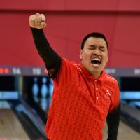 Richard Dolan cheers at the bowling alley.