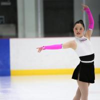 Special Olympics Alberta athlete Meg Ohsada poses on the ice