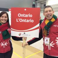SOO's Juli Prokopchuk-Brattan and athlete Stephen Graham hold a sign that reads Ontario.