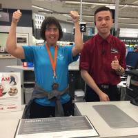 Thumbs up for Give a Toonie Share a Dream at the Staples store in Coquitlam. 