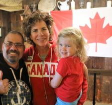 Marnie McBean with daughter Isabel and Special Olympics Team Canada athlete.