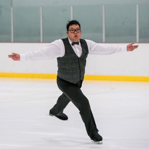 Alexander Pang performs on the ice.