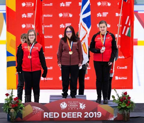 Melanie Taylor stands on the first place podium at Canada Games