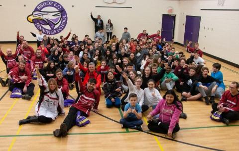 Special Olympics Ontario floor hockey team pose for photo with middle school students who helped fund their trip to the Special Olympics Canada Winter Games Thunder Bay 2020.