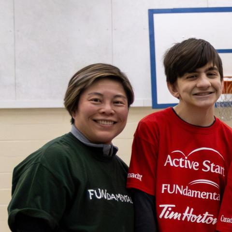 Phoebe smiling with SOBC youth participant