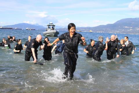 Lots of high-fives as the Vancouver Police Department team takes the Plunge. Photo by Tim Fitzgerald.