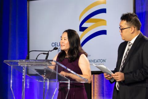 SOBC athletes Alexander Pang and Susan Wang on podium speaking
