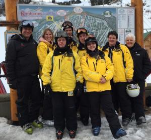 SOBC - Kimberley/Cranbrook ski team and coaches smiling for group photo