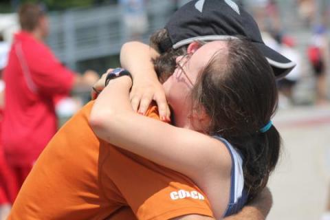 Two SOBC athletes happily embracing each other