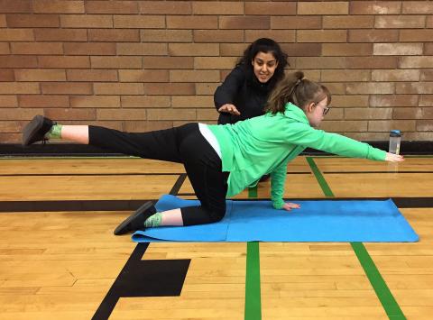 Special Olympics functional testing four-point opposite arm and leg raise