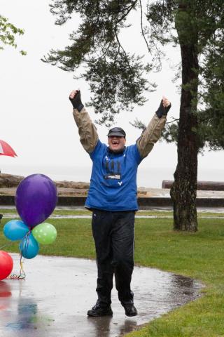 SOBC – North Shore walkathon participant celebrating with hands in air