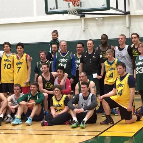 SOBC - Prince George basketball team and UNBC players and coaches on-court group photo