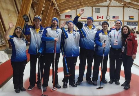Campbell River Rocks curling team group photo on curling ice